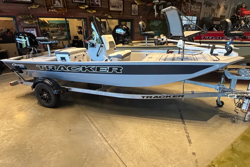 The Image of 2027 Tracker Bass Tracker Classic CC boat on trailer in showroom. - 0