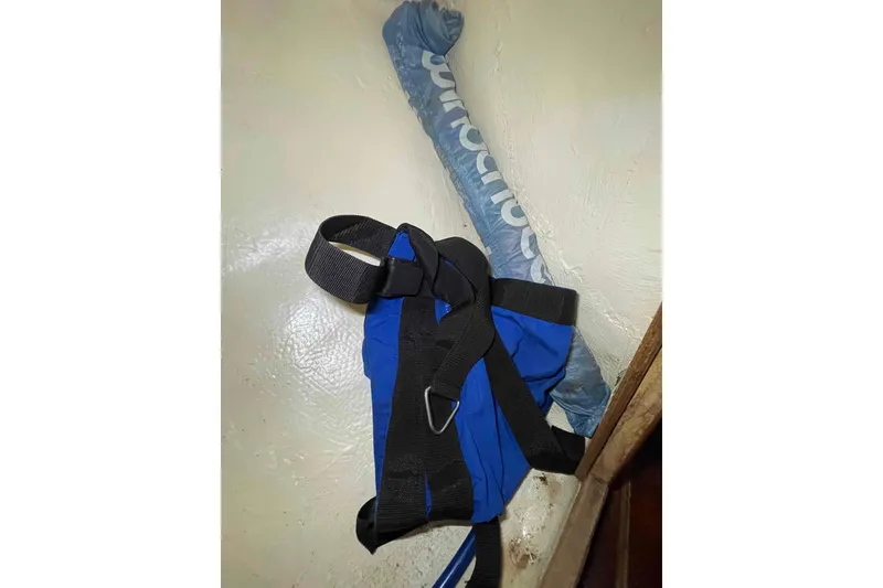 Slide: The Image of Blue bosun harness and wind scoop. - 104