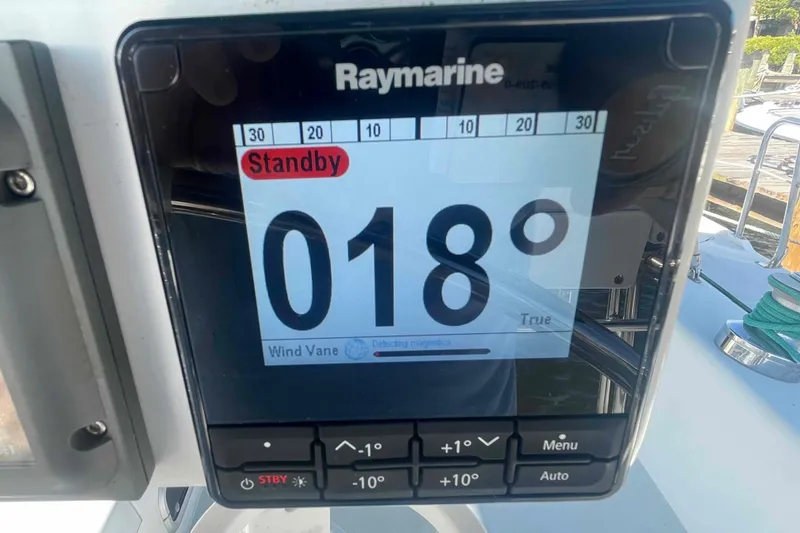 Slide: The Image of Raymarine EV-100 Autopilot display on Catalina 320 sailboat showing 018° heading in standby mode. - 76