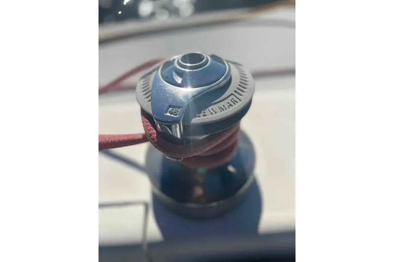 Slide: The Image of Winch on a 1995 Catalina 320 sailboat with red rope wrapped around. - 114
