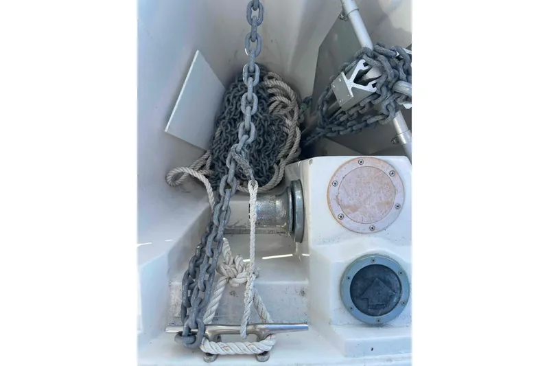 Slide: The Image of Anchor and chain setup on a Catalina 320 sailboat deck. - 60