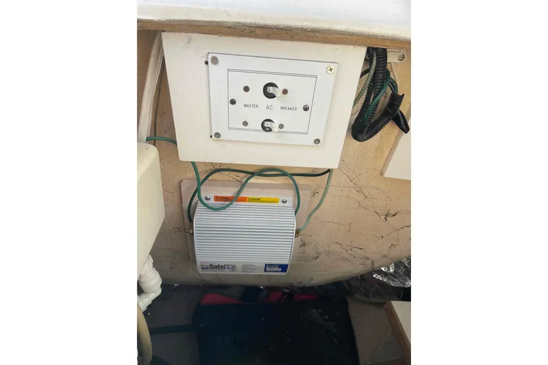 Slide: The Image of 110VAC Electrical breakers and Galvanic Isolator inside a Catalina 320 boat. - 65