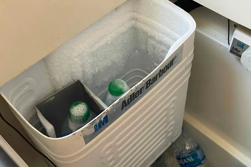 Slide: The Image of Frosted cooler with bottles inside a 1995 Catalina 320 boat. - 20
