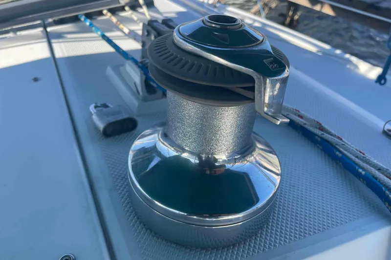 Slide: The Image of Winch on 1995 Catalina 320 sailboat deck, with ropes and hardware visible. - 113