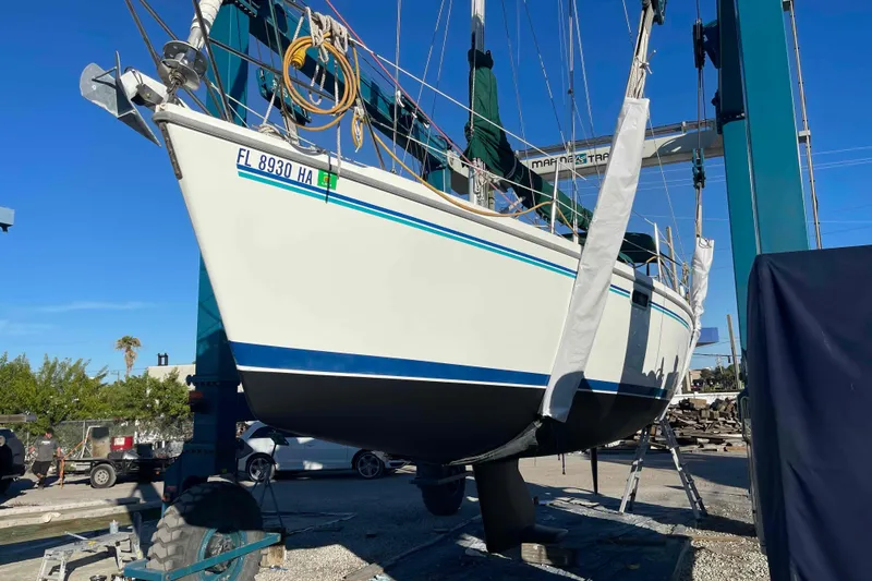Slide: The Image of Catalina 320 sailboat in dry dock, undergoing maintenance. - 50