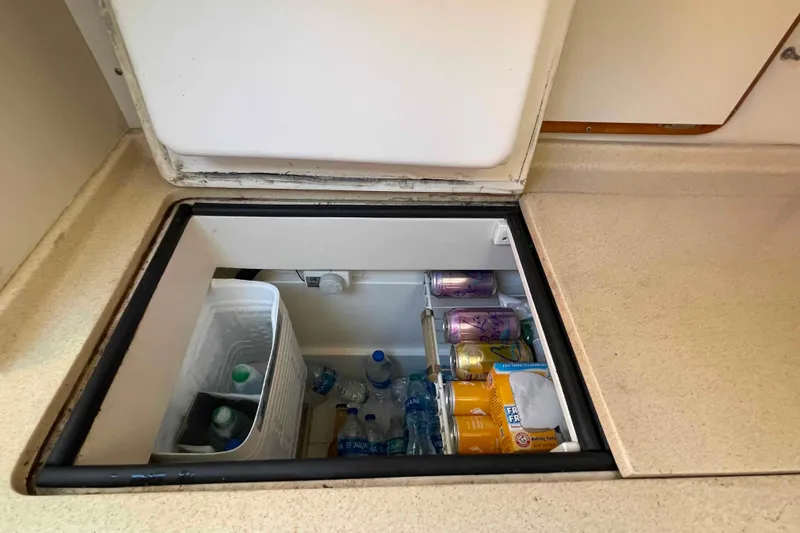 Slide: The Image of Built-in 12VDC refrigeration on 1995 Catalina 320 yacht, stocked with drinks and supplies. - 19