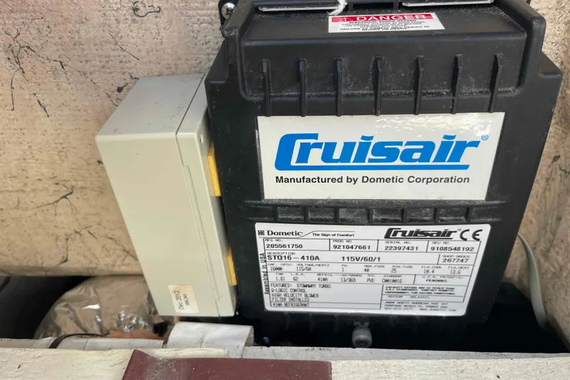 Slide: The Image of Cruisair Air Conditioning unit by Dometic Corporation on a Catalina 320 boat. - 66