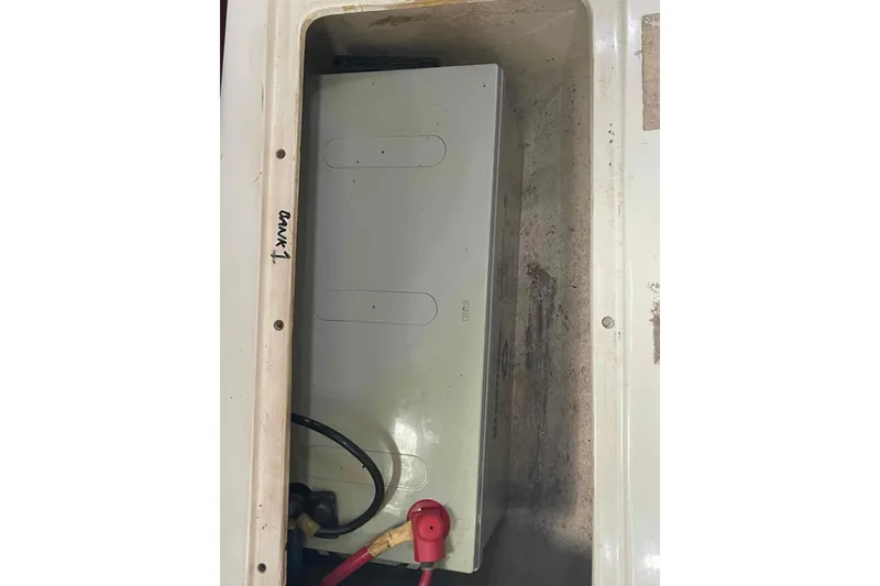Slide: The Image of Battery compartment of a Catalina 320 sailboat, labeled "Tank 1." - 69
