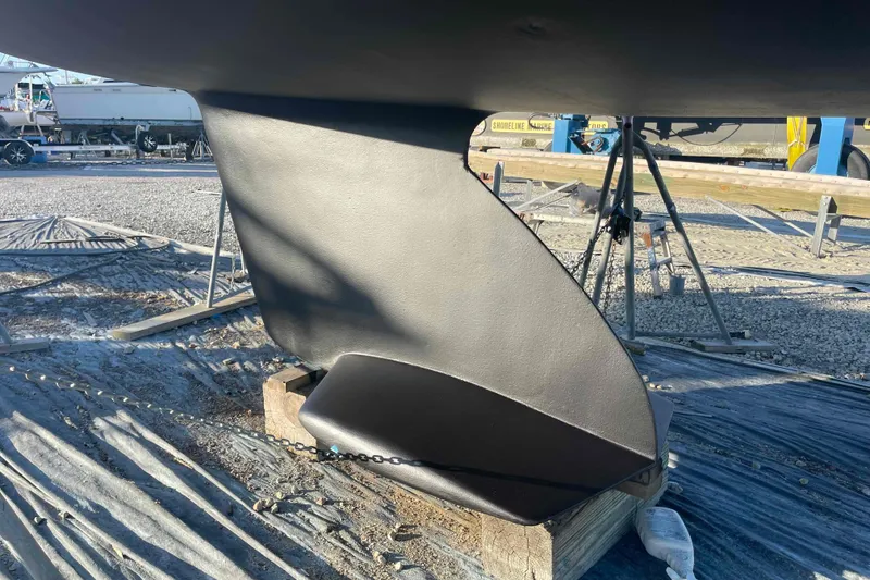 Slide: The Image of Keel of a Catalina 320 sailboat on a stand in a boatyard. - 41
