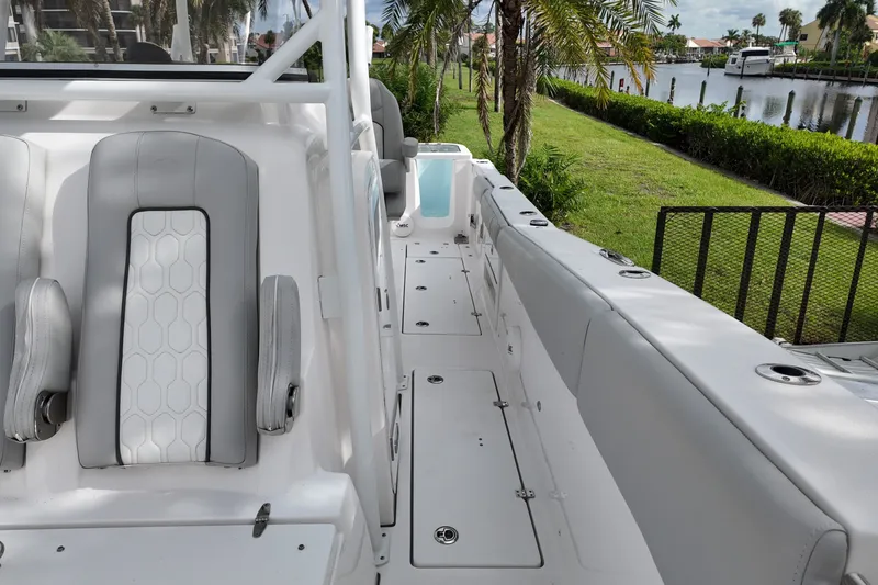 Slide: The Image of 2023 Sea Fox 328 Commander boat interior with seating and deck view. - 15