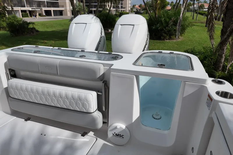 Slide: The Image of 2023 Sea Fox 328 Commander boat interior with seating and dual outboard engines. - 11