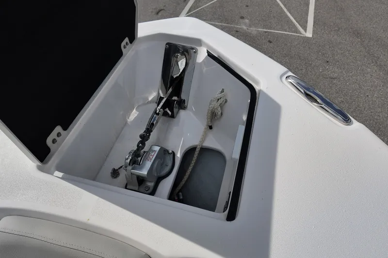 Slide: The Image of Anchor storage compartment on 2023 Sea Fox 328 Commander boat, featuring chain and rope. - 8