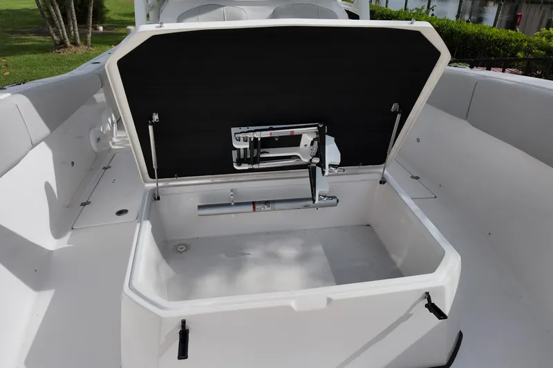 Slide: The Image of 2023 Sea Fox 328 Commander boat storage compartment open, showcasing interior features. - 7