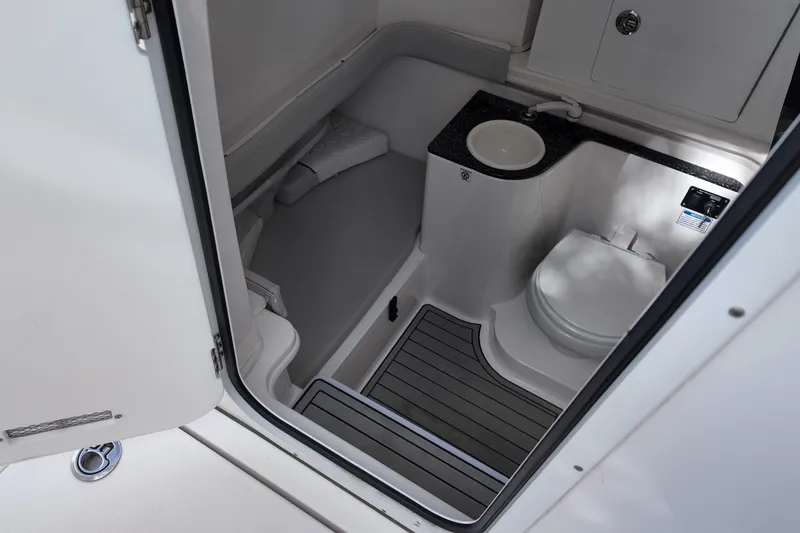 Slide: The Image of 2023 Sea Fox 328 Commander boat bathroom interior with sink and toilet. - 10