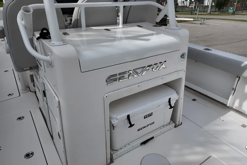 Slide: The Image of 2023 Sea Fox 328 Commander boat interior with Yeti cooler storage. - 12