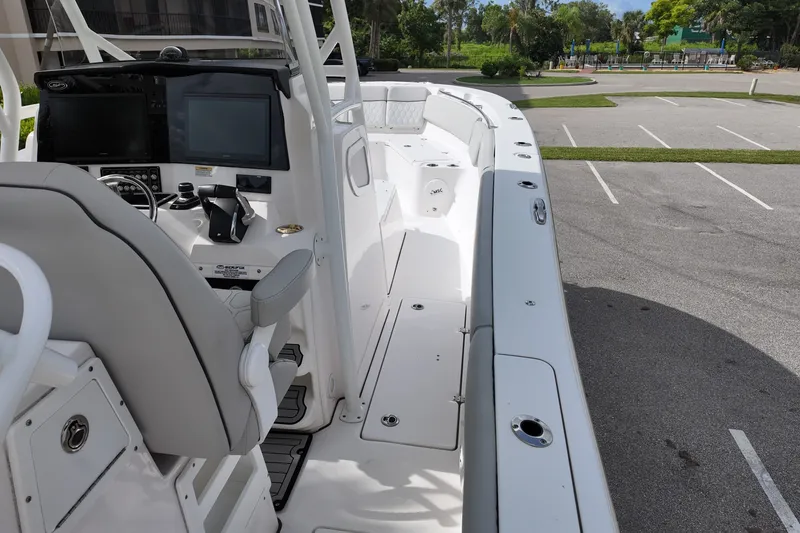Slide: The Image of 2023 Sea Fox 328 Commander boat interior with helm and seating area. - 13