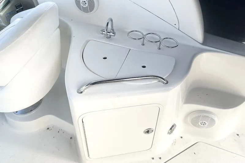 Slide: The Image of Interior view of a 2006 Sea Ray Sundancer 280 boat with seating and storage. - 14
