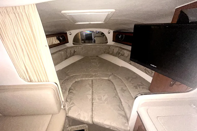 Slide: The Image of Interior cabin of 2006 Sea Ray Sundancer 280 with bed and TV. - 16