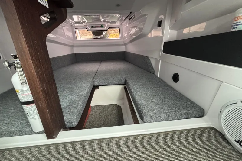 Slide: The Image of Interior cabin of 2025 Axopar 29 XC Cross Cabin with gray seating and modern design. - 28