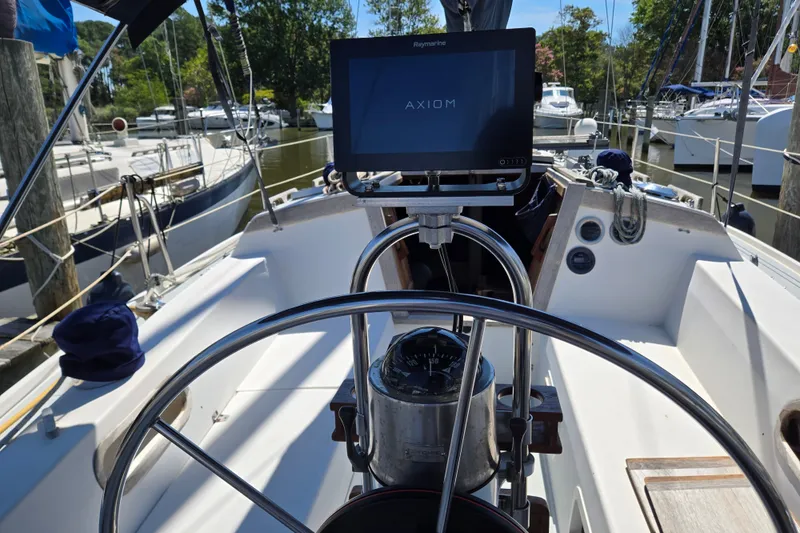 Slide: The Image of Cockpit view of a 1989 Catalina 34 sailboat with navigation equipment. - 8