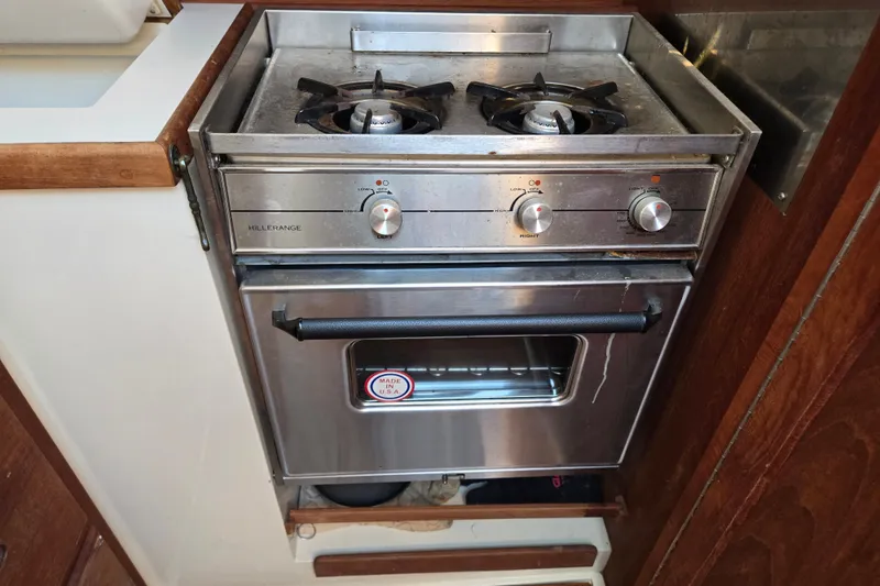 Slide: The Image of Stainless steel stove and oven in 1989 Catalina 34 yacht kitchen. - 19