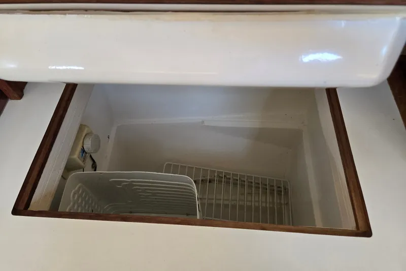 Slide: The Image of Open storage compartment in 1989 Catalina 34 boat interior. - 20