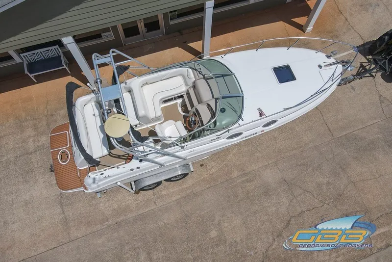 Slide: The Image of 2000 Sea Ray Sundancer 260 boat, aerial view, docked on concrete surface. - 25