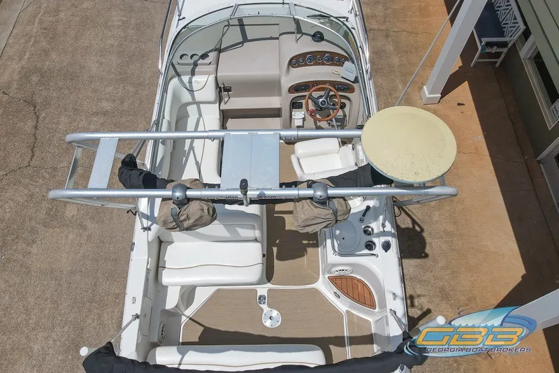 Slide: The Image of Top view of a 2000 Sea Ray Sundancer 260 boat with cockpit and seating area. - 2