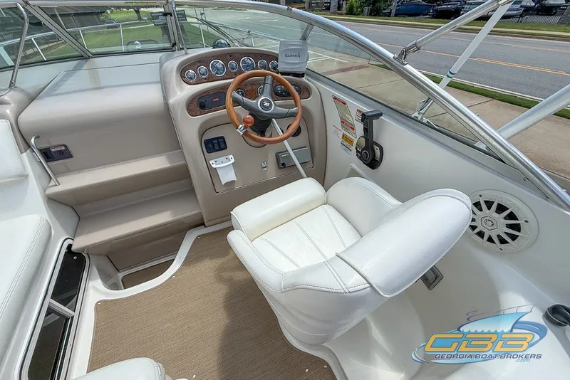 Slide: The Image of Cockpit of 2000 Sea Ray Sundancer 260 with steering wheel and control panel. - 5