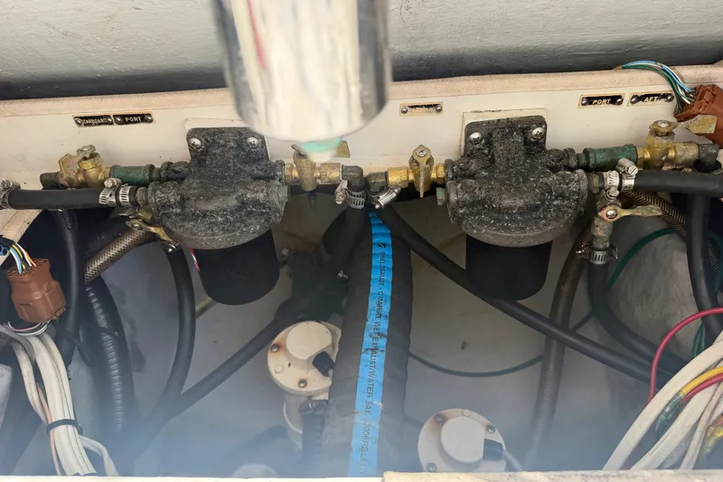Slide: The Image of Engine compartment of a 2001 SeaVee 290B boat, showing fuel filters and hoses. - 8