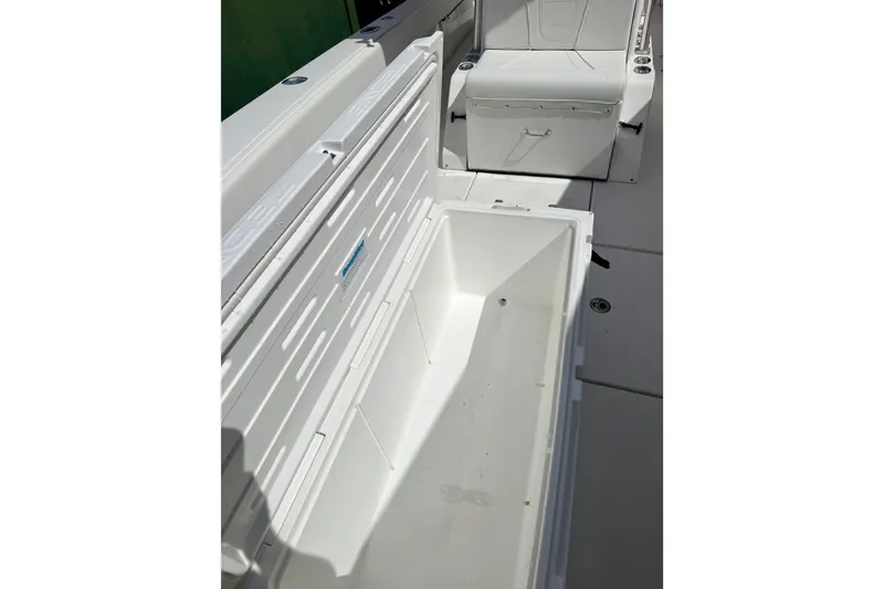 Slide: The Image of Open storage compartment on 2001 SeaVee 290B boat, showcasing spacious interior design. - 7