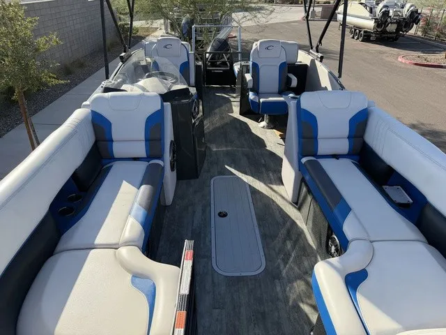 Slide: The Image of The image shows the interior of a 2023 Crest Caribbean LX 230 SLS CP3 with blue and white seating. - 8