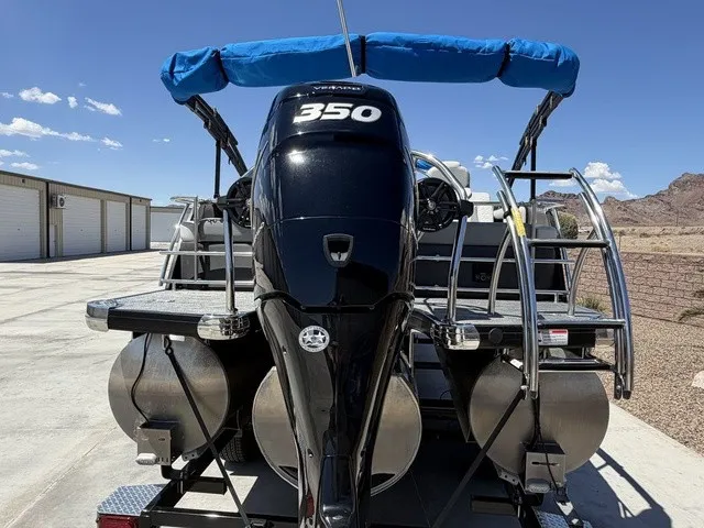 Slide: The Image of A 2022 Godfrey Pontoons Monaco 255 DFL 27 In. with a 350 HP engine, on a trailer. - 22