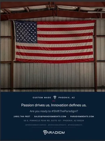 Slide: The Image of Flag in a warehouse with promotional text for Parsdigm boats. - 11