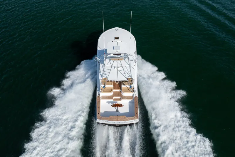 Slide: The Image of Custom Carolina East Bay 2001 yacht cruising on open water, aerial view. - 4