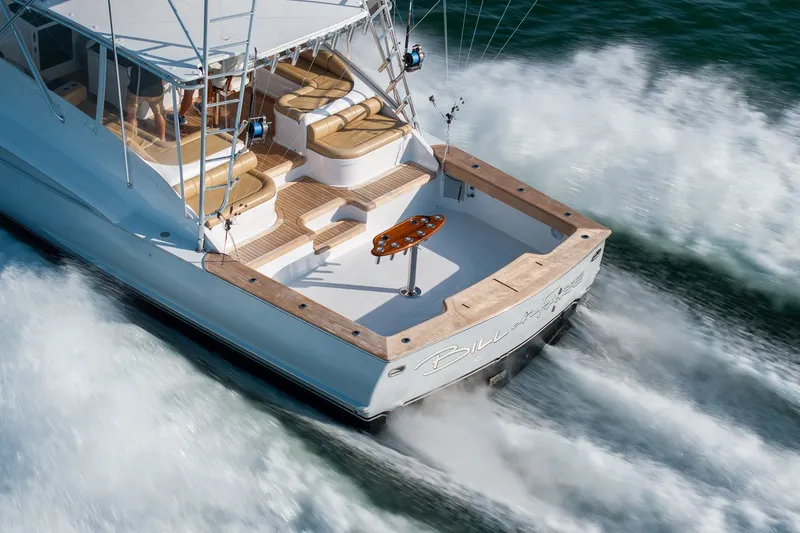 Slide: The Image of Custom Carolina East Bay 2001 yacht cruising swiftly on open water. - 1