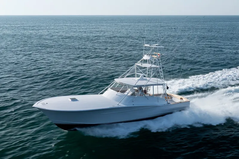 Slide: The Image of Custom Carolina East Bay 2001 yacht cruising on open ocean waters. - 10