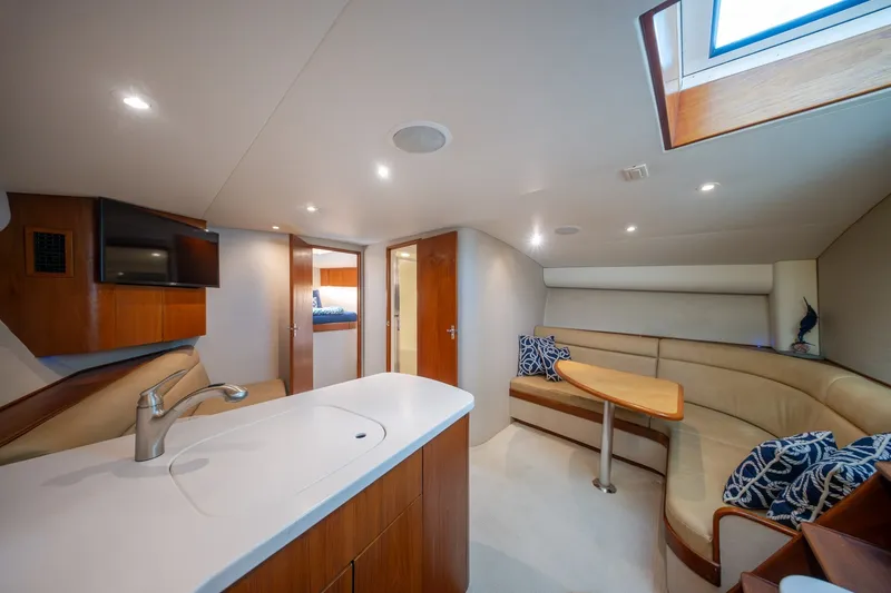 Slide: The Image of Luxurious interior of 2001 Custom Carolina East Bay yacht with modern amenities and cozy seating. - 42