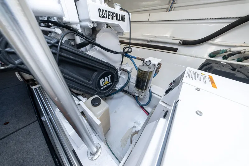 Slide: The Image of Engine room of 2001 Custom Carolina East Bay with Caterpillar marine power system. - 58