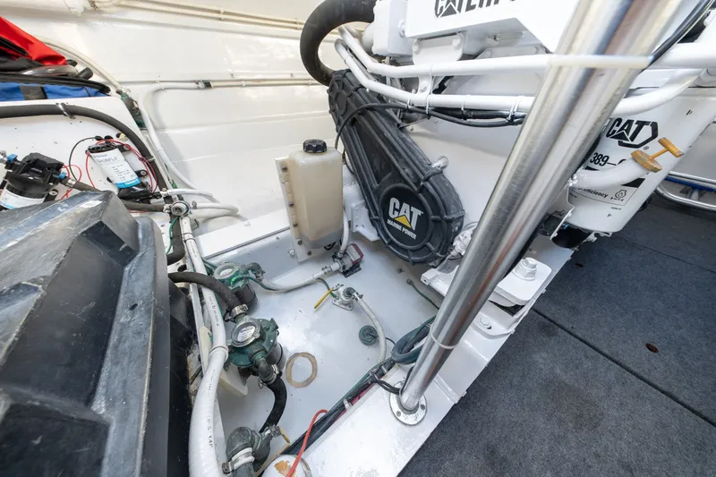 Slide: The Image of Engine room of 2001 Custom Carolina East Bay boat with CAT marine power components. - 57