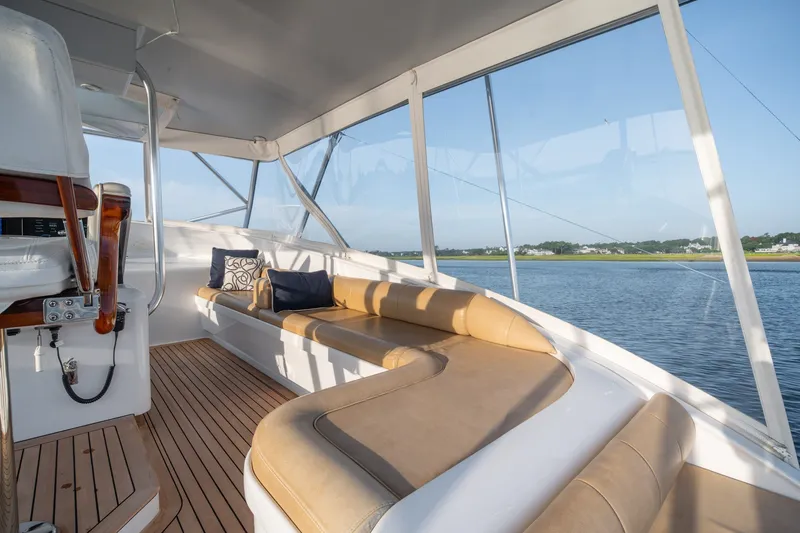 Slide: The Image of Luxurious 2001 Custom Carolina East Bay yacht interior with plush seating and scenic water views. - 15