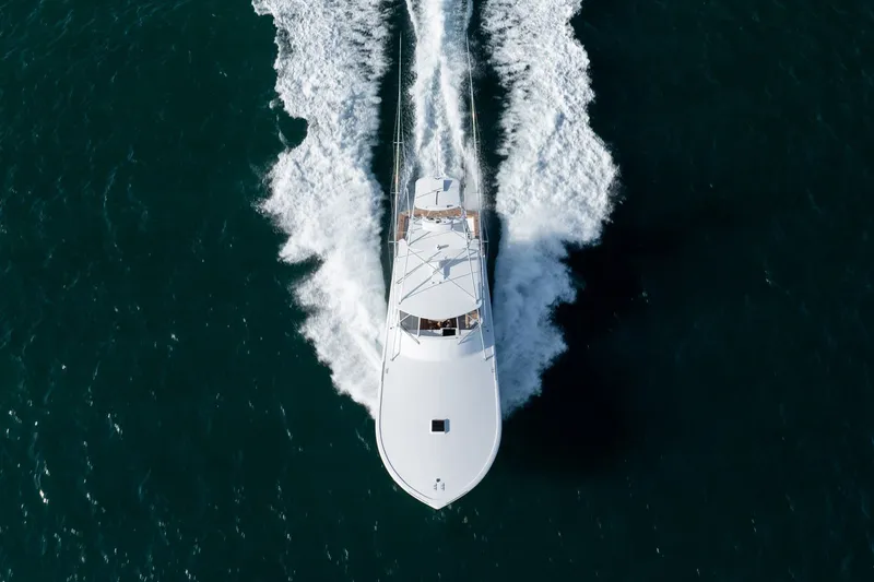 Slide: The Image of Aerial view of 2001 Custom Carolina East Bay yacht cruising on open water. - 62