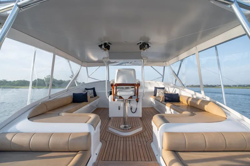 Slide: The Image of Luxurious 2001 Custom Carolina East Bay yacht interior with plush seating and scenic views. - 13