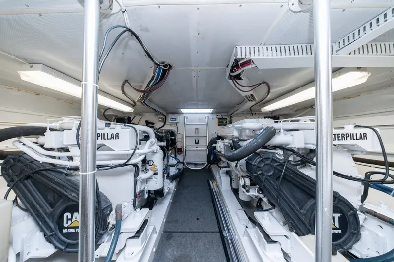 Slide: The Image of Engine room of 2001 Custom Carolina East Bay boat with Caterpillar marine engines. - 51