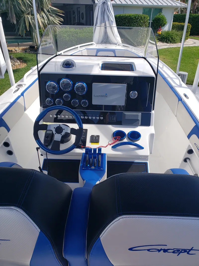 Slide: The Image of The cockpit of a 2020 Concept 30' Open Deck boat with modern instruments and blue accents. - 8