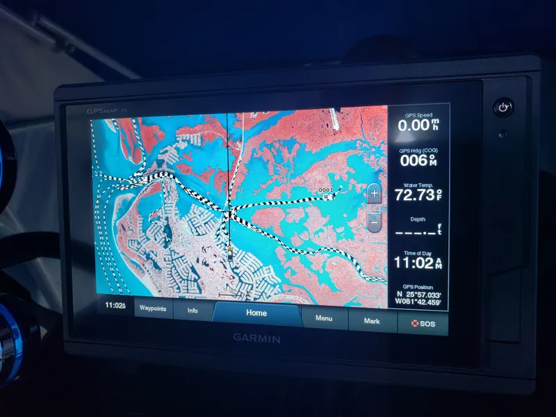 Slide: The Image of A Garmin navigation system displays a map with waterways and temperature information. - 10