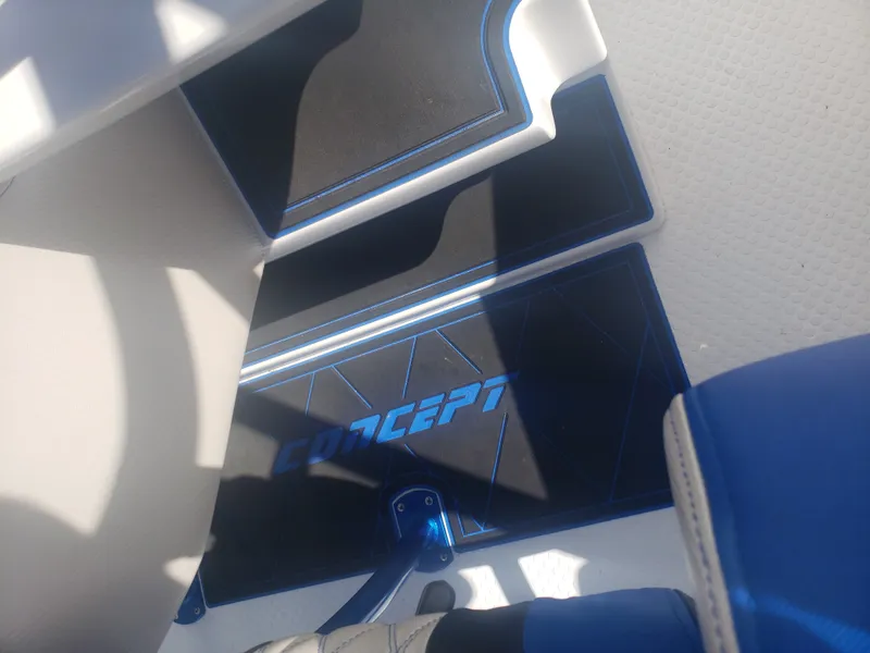 Slide: The Image of The image shows a boat floor with blue and black mats featuring the "Concept" logo. - 27