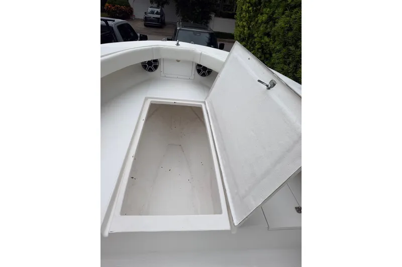 Slide: The Image of Open storage compartment on a 2000 Ocean Runner 27 boat deck. - 27