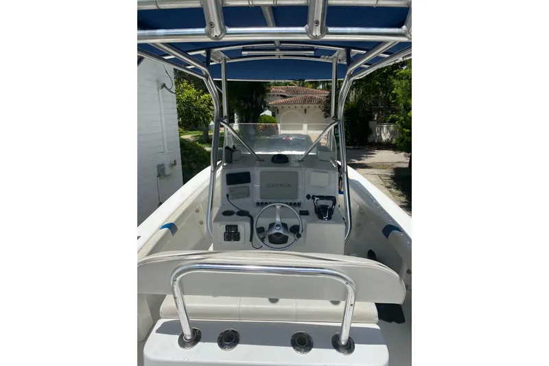 Slide: The Image of Center console of a 2000 Ocean Runner 27 boat with steering wheel and navigation equipment. - 4