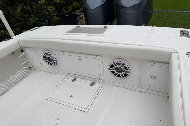 Slide: The Image of Interior of a 2000 Ocean Runner 27 boat featuring speakers and storage compartments. - 31